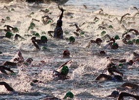 Competitors in the famous Ironman challenge take on the first leg