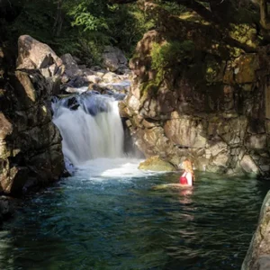 Women in a lake district waterfall
