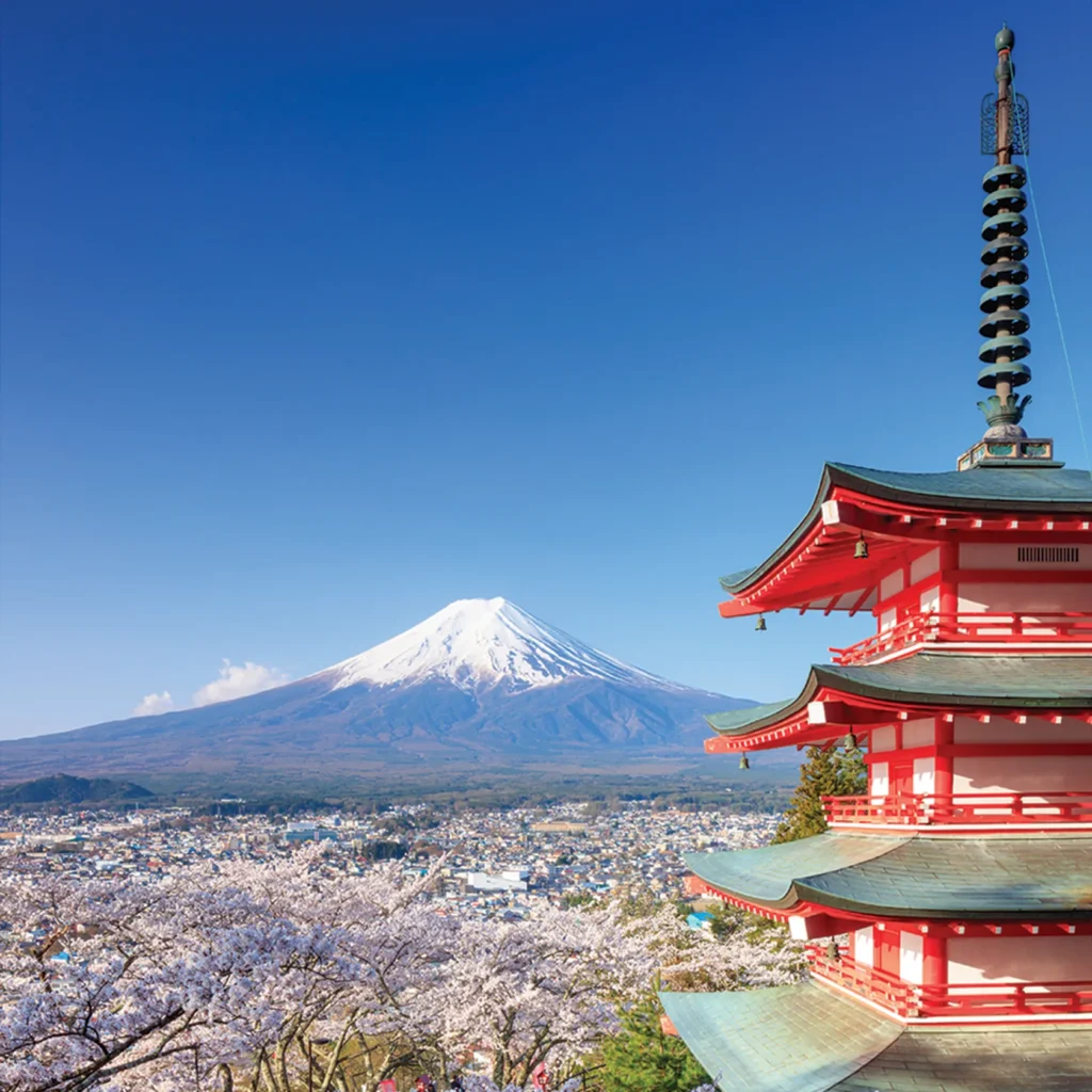 Traditional Japanese temple with a backdrop of mount fuji 