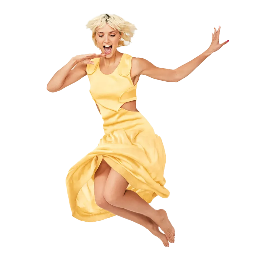 Image of Jessie Inchauspe jumping in a yellow dress