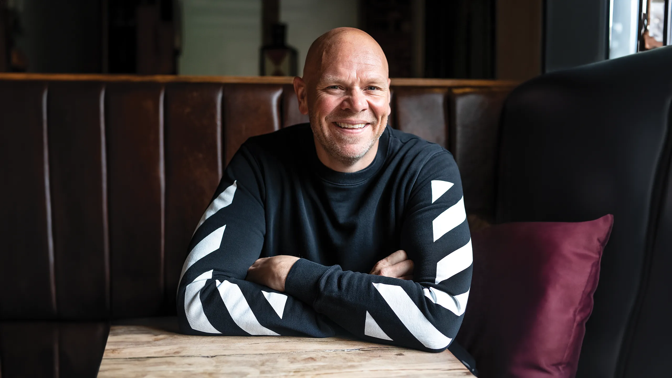 An image of Tom Kerridge seated at a pub table