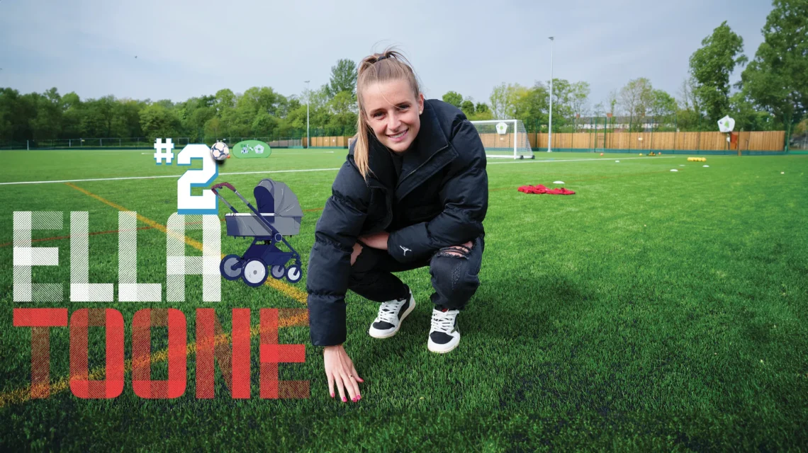 Ella Toone crouching with her hand ouching the grass of a football pitch