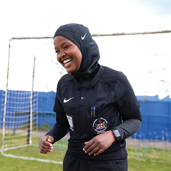 JJ Roble enjoying herself on the football pitch in front of a goal