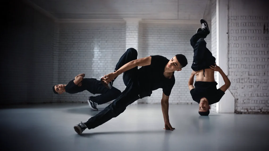 image of breakdancer in three poses in a grey studio
