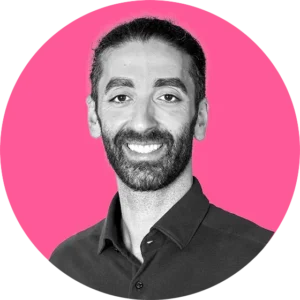 Alex Manos on a pink circle background
