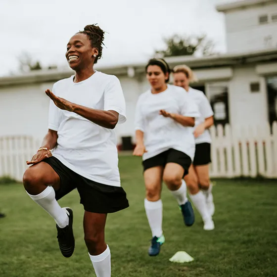 Women warming up before starting a football game