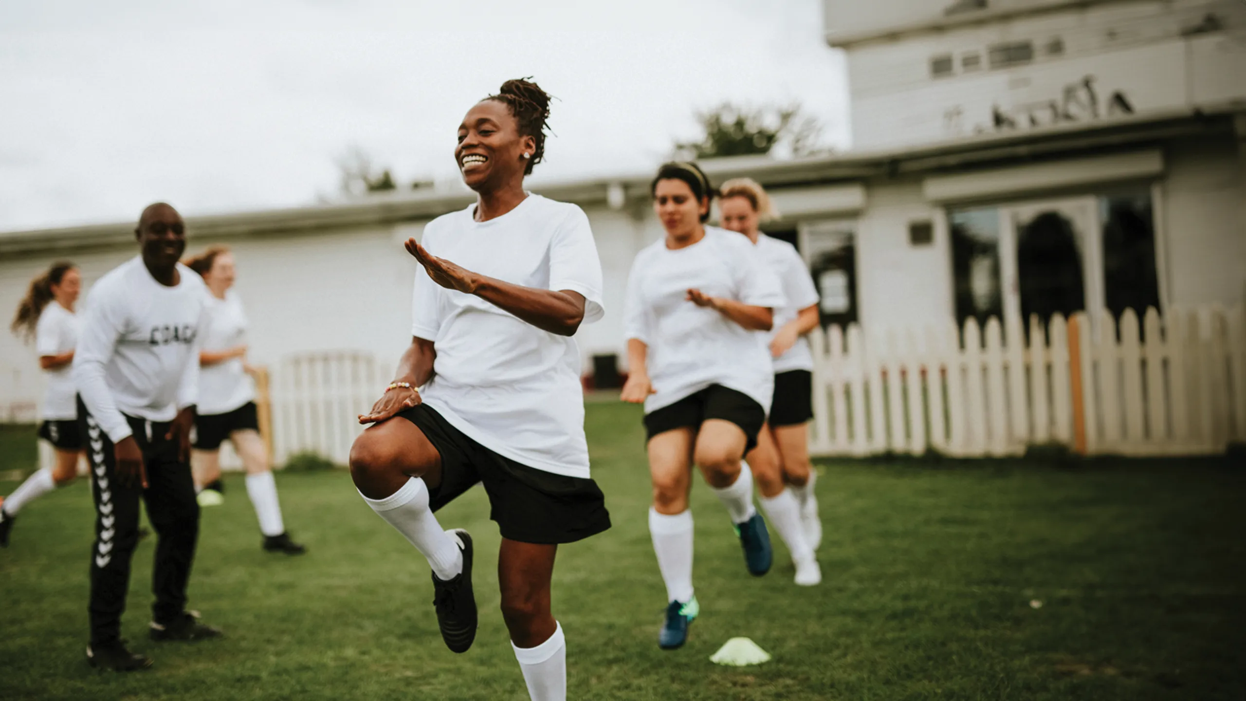 Women warming up before starting a football game
