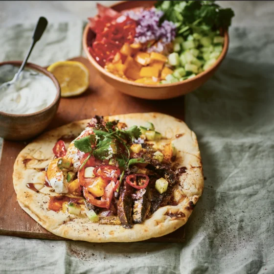 Claire Thompson whips up this juicy spiced mushroom shawarma with chopped salad and pomegranate molasses for a flavour-packed vegetarian feast